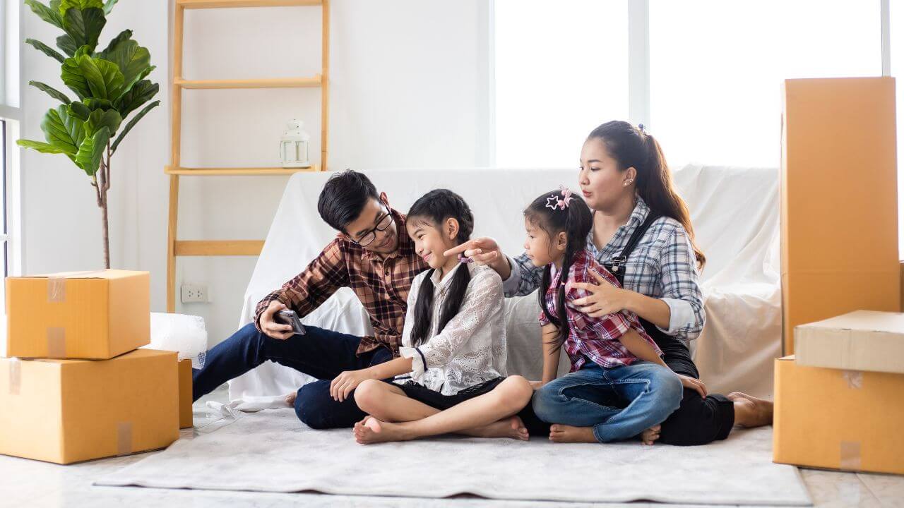 family in a rental home with moving boxes